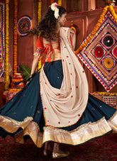 Orange kutchi work blouse with teal blue chaniya choli